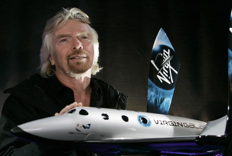 Sir Richard Branson, founder of Virgin Galactic, is seen with a model of the Spaceship Two at the America Museum of Natural History in New York, January 23, 2008