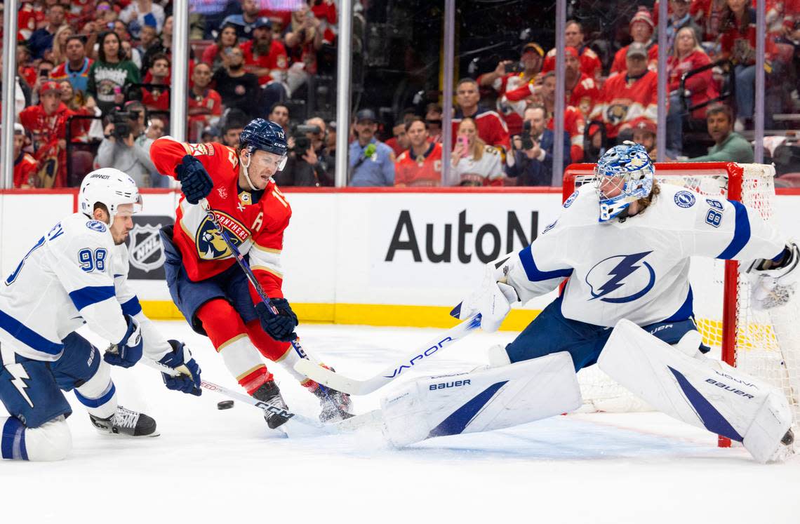 Florida Panthers left wing Matthew Tkachuk (19) takes a shot on goal against Tampa Bay Lightning defenseman Mikhail Sergachev (98) and goaltender Andrei Vasilevskiy (88) during the first period of Game 5 of Round 1 of the Stanley Cup Playoffs on Monday, April 29, 2024, at Amerant Bank Arena in Sunrise, Fla.