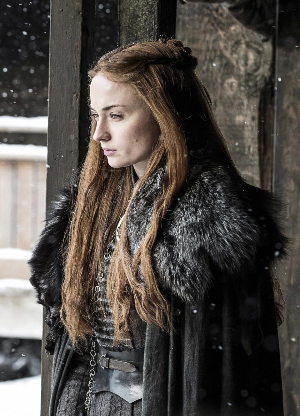 Finally, back at Winterfell, Sansa's look is all her own. It combines elements of House Tully and House Stark imagery.