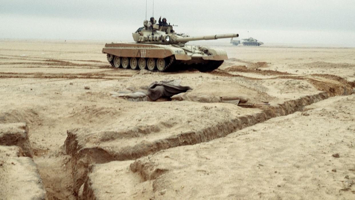 kuwait army m 84 tank driving through minefield during operation desert storm on march 1 1991