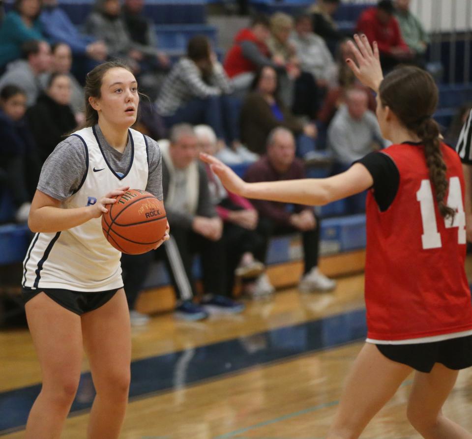 John Jay's Grace Kennedy faces up against a Red Hook defender during a girls basketball scrimmage on November 30, 2023.