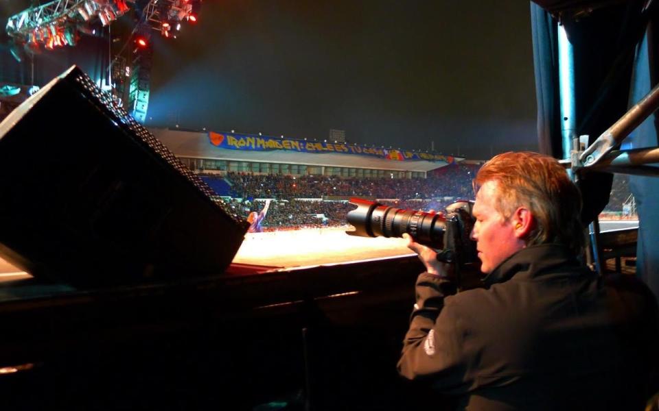 John McMurtrie photographing Iron Maiden in Santiago, Chile