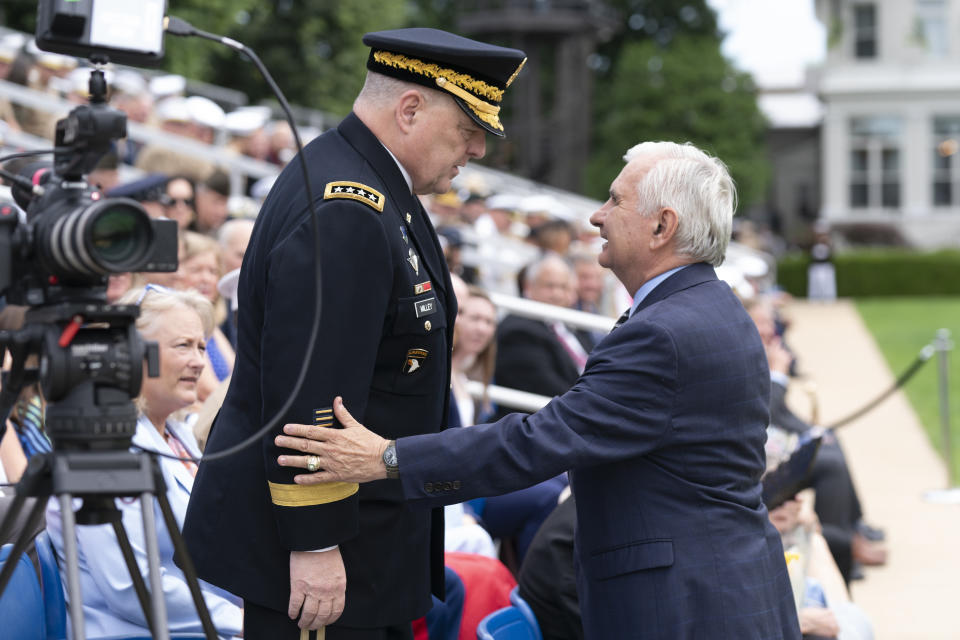 Chairman of the Joint Chiefs Gen. Mark Milley, left, talks to Sen. Jack Reed, D-R.I., during a relinquishment of office ceremony for U.S. Marine Corps Gen. David Berger on Monday, July 10, 2023, at the Marine Barracks in Washington. Gen. Eric Smith has been nominated to be the next leader, but will serve in an acting capacity because he hasn't been confirmed by the Senate. (AP Photo/Manuel Balce Ceneta)