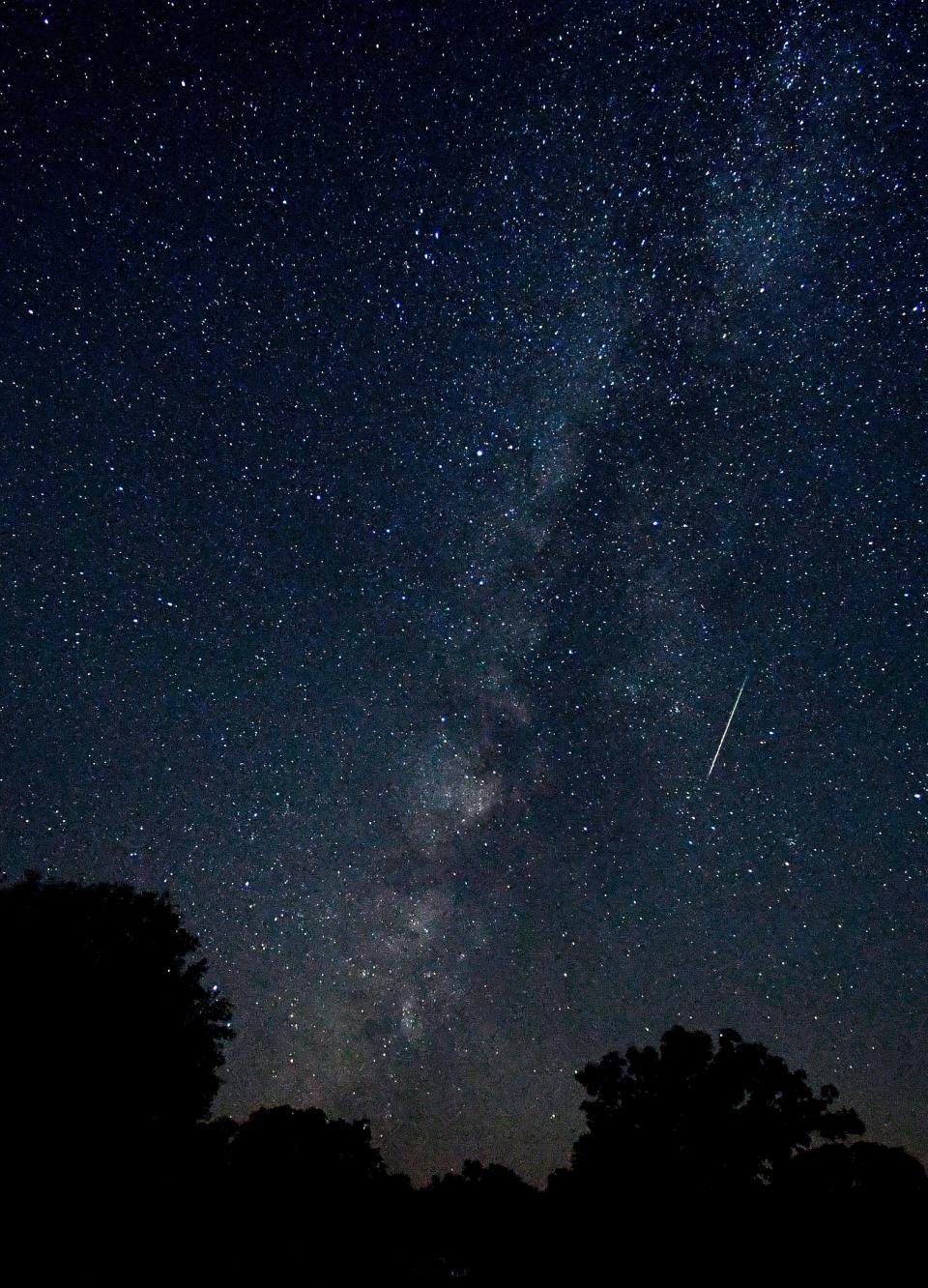 A meteor is caught as a blurred line in this eight-second exposure Aug. 12 of the Milky Way over Abilene State Park. Meteor showers tends to be most visible after midnight, which is when astronomers say stargazers have their best chance of seeing the Southern Taurid meteor stream when it reaches peak activity Sunday.