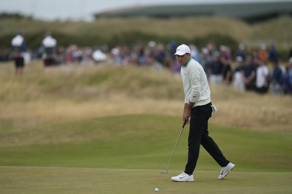 Scottie Scheffler of the US after missing a putt on the 16th green during the third round of the British Open golf championship on the Old Course at St. Andrews, Scotland, Saturday July 16, 2022. (AP Photo/Alastair Grant)