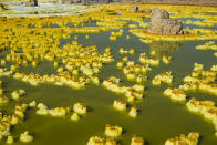 <p>Despite being called a volcano, Dallol is a hydrothermal field located in the northern Danakil Depression. The otherworldly landscape can be lethal for explorers, as temperatures often climb above 50°C. (Photo: Francesco Pandolfo/Caters News) </p>