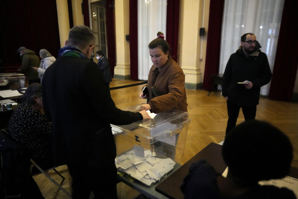 A woman votes in a citywide mini-referendum: "For or against self-service scooters in Paris?" at the city hall of the 10th district of Paris, Sunday, April 2, 2023. The wheels may be about to come off Paris' experiment with for-hire electric scooters. That's if Parisians vote on Sunday to do away with the 15,000 opinion-dividing micro-vehicles. (AP Photo/Thibault Camus)