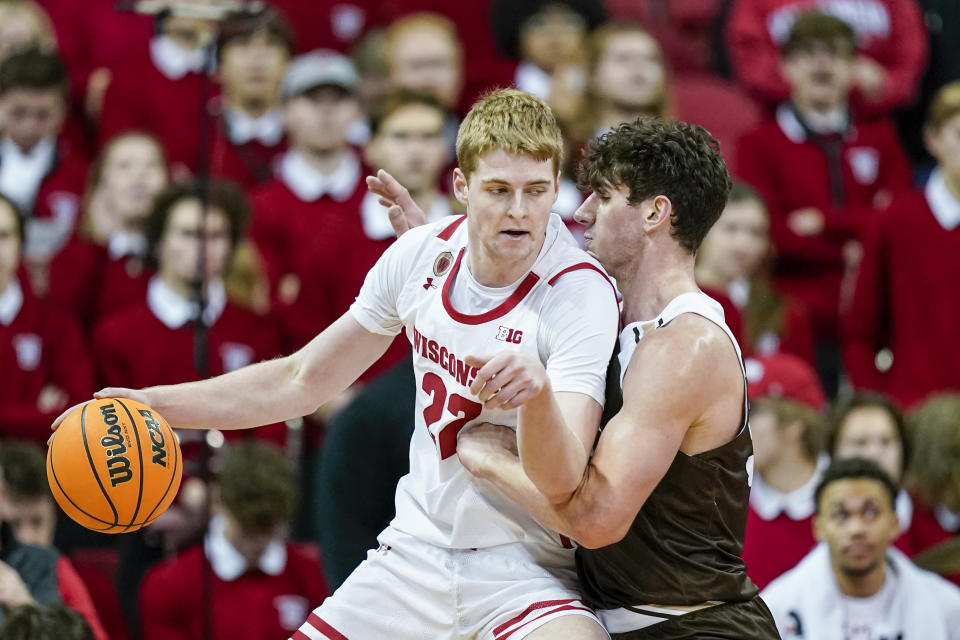 Wisconsin's Steven Crowl (22) drives against Lehigh's Dominic Parolin (35) during the first half of an NCAA college basketball game Thursday, Dec. 15, 2022, in Madison, Wis. (AP Photo/Andy Manis)