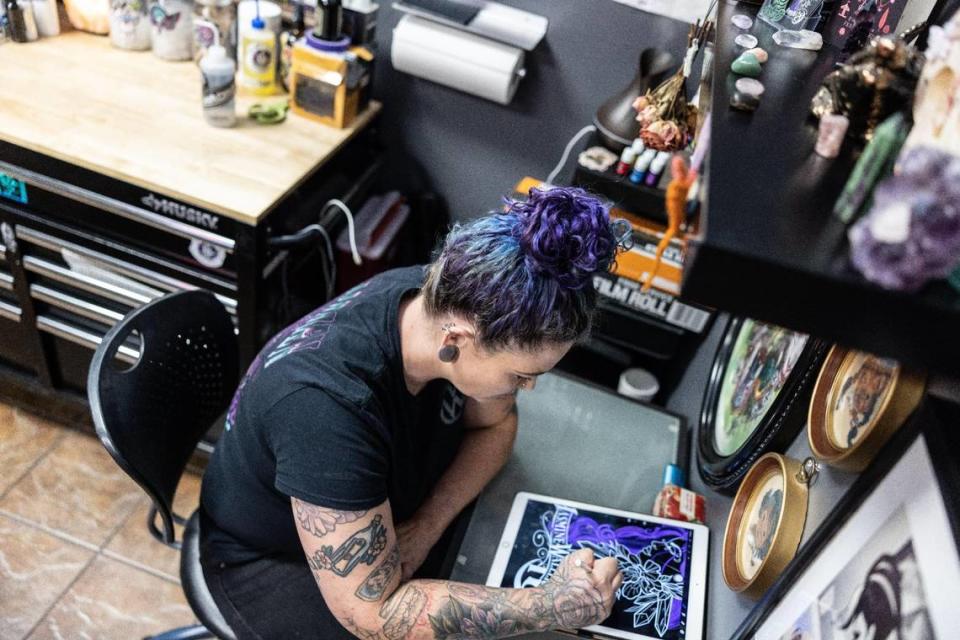 Jasmine Waller, a tattoo artist at Tattoo Bill’s works on a drawing Wednesday. Tattoo Bill’s won the The Charlotte Observer’s 2023 Readers’ Choice best tattoo shop contest.