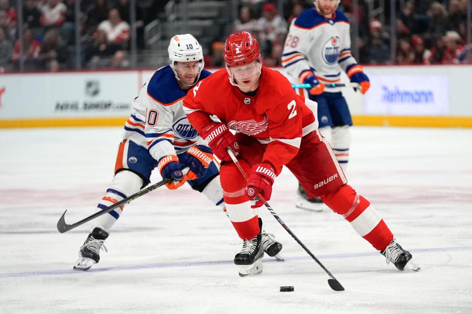 Detroit Red Wings defenseman Olli Maatta (2) skates with the puck as Edmonton Oilers center Derek Ryan (10) pursues in the second period at Little Caesars Arena in Detroit on Thursday, Jan. 11, 2024.
