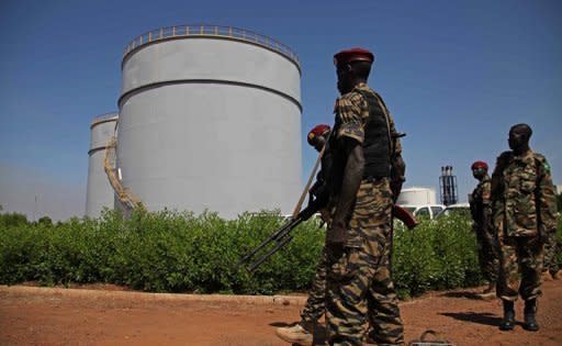 South Sudanese soldiers guard an oil refinery in Melut, Upper Nile State, South Sudan on November 20, 2012. South Sudan has restarted oil production, ending a 15-month bitter row with former civil war foe Sudan and marking a major breakthrough in relations after bloody border clashes last year