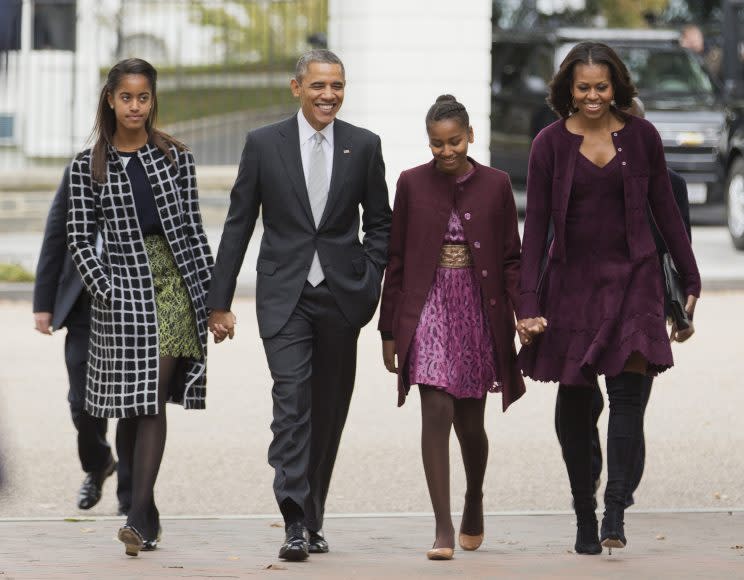 President Barack Obama, second from left, with first lady Michelle Obama, right, and their daughters Malia, left, and Sasha, walk from the White House in Washington to attend a church service on Oct. 27, 2013. (Photo: Manuel Balce Ceneta/AP)