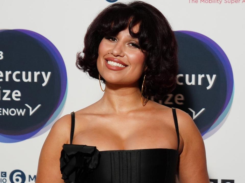 Fellow first-time nominee RAYE was seen grinning in the audience as Ezra Collective accepted their award (PA)