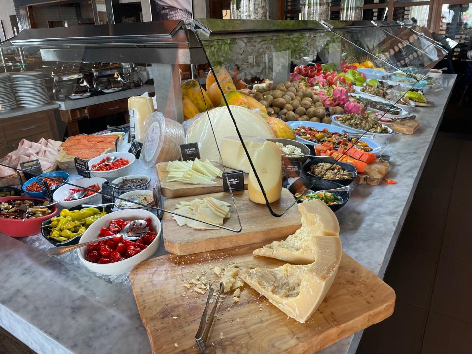 cheese, fruits, and other sides at the buffet in a fogo de chao steak house