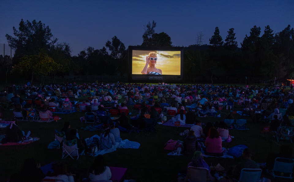 Crowd watches Barbie.