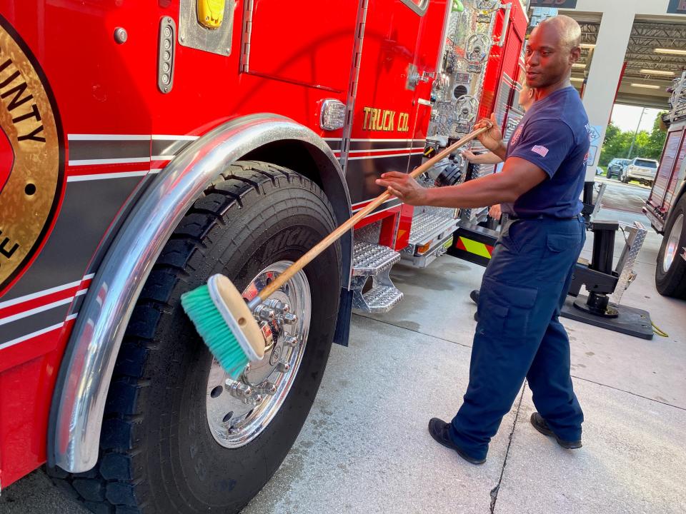 A Palm Beach County Fire Rescue worker puts the finishing touches on its newest vehicle - Truck 29, which reaches higher vertically and extend farther horizontally than any other aerial apparatus in its fleet and carries cutting-edge technology that supports firefighter health and safety initiatives.