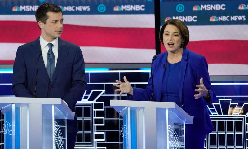 Senator Amy Klobuchar speaks as former South Bend Mayor Pete Buttigieg listens at the ninth Democratic 2020 U.S. Presidential candidates debate at the Paris Theater in Las Vegas