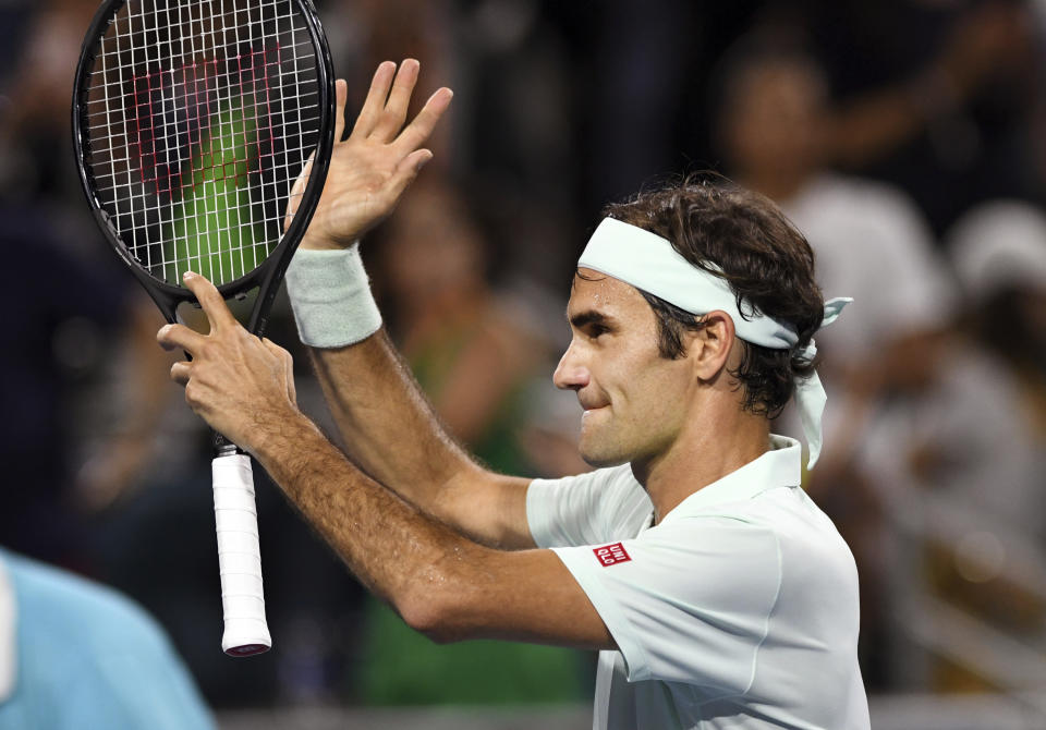 Roger Federer, of Switzerland, acknowledges the fans after his 6-2, 6-4 win over Denis Shapovalov, of Canada, during the semifinals of the Miami Open tennis tournament Friday, March 29, 2019, in Miami Gardens, Fla. (AP Photo/Jim Rassol)