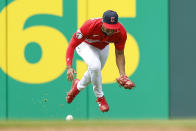 Cleveland Guardians' Richie Palacios cannot make a catch on a single by Cincinnati Reds' Tyler Naquin during the eighth inning of a baseball game, Thursday, May 19, 2022, in Cleveland. (AP Photo/Ron Schwane)