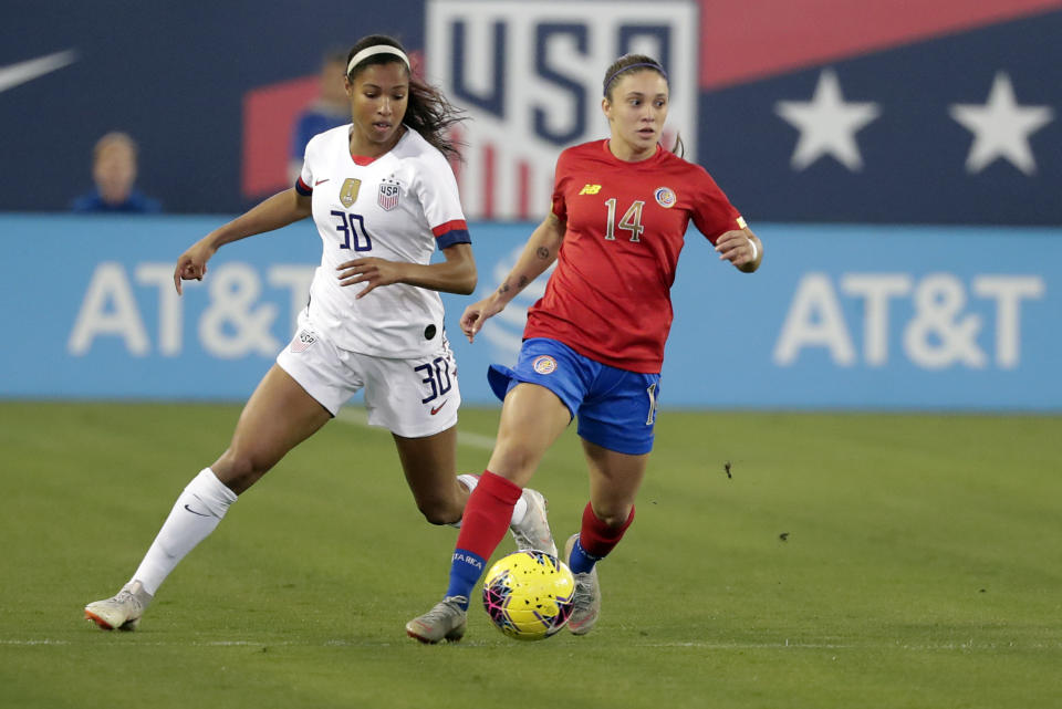 Costa Rica forward Priscilla Chinchilla (14) moves the ball past U.S. forward Margaret Purce (30) during the first half of an international friendly soccer match Sunday, Nov. 10, 2019, in Jacksonville, Fla. (AP Photo/John Raoux)