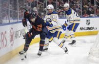 Buffalo Sabres' Henri Jokiharju (10) and Owen Power (25) chase Edmonton Oilers' Leon Draisaitl (29) during second-period NHL hockey game action in Edmonton, Alberta, Thursday March 21, 2024. (Jason Franson/The Canadian Press via AP)