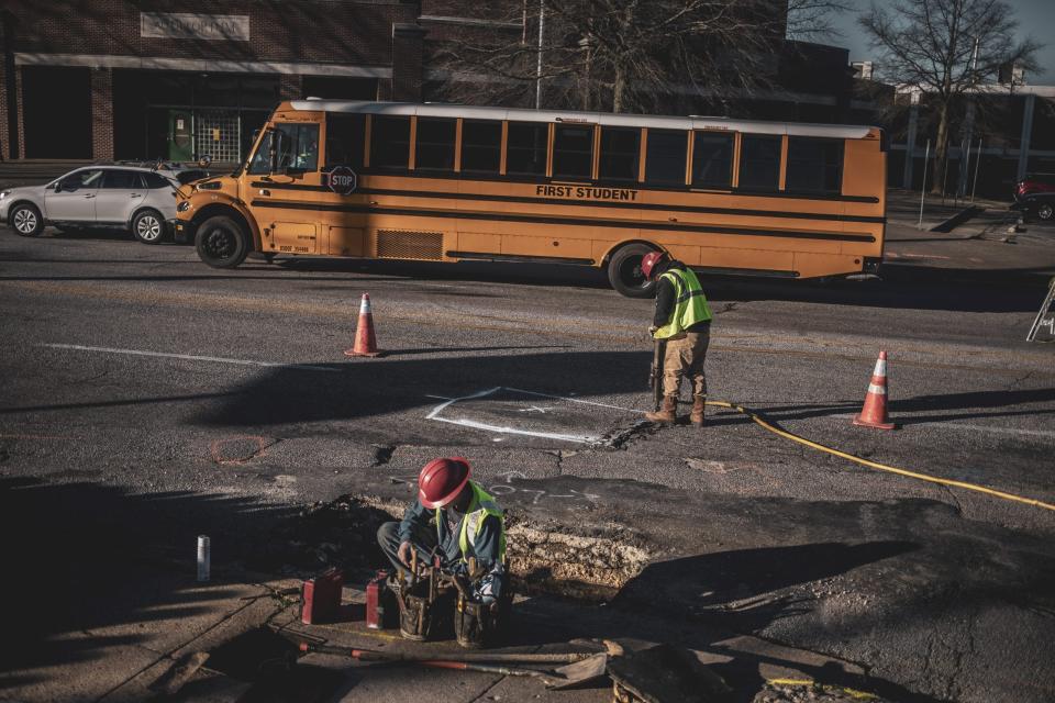 MEMPHIS, TN - January 13, 2022: A crew for MLGW works on replacing the lead pipes running under Lauderdale Avenue in South Memphis.
