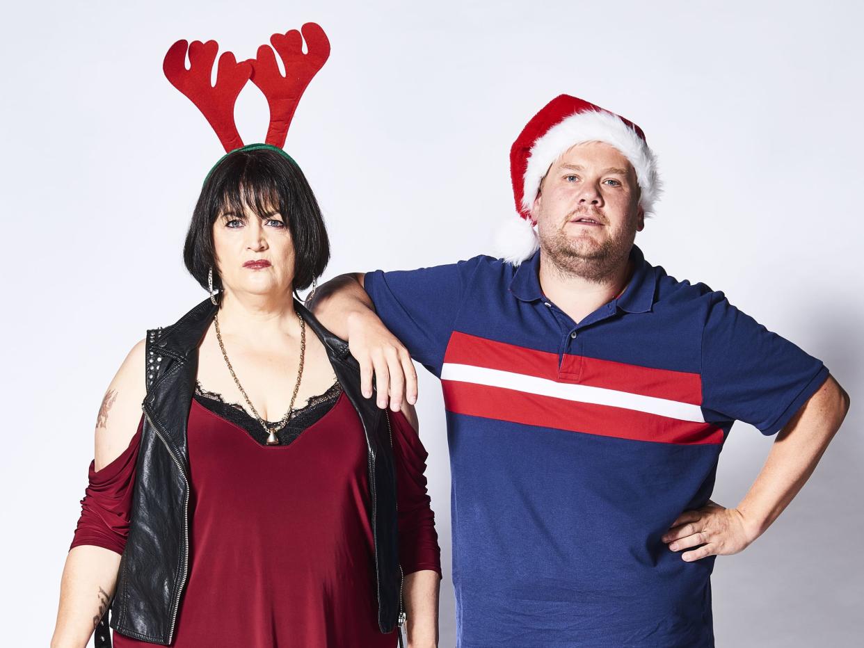Nessa, wearing antlers, stands next to Smithy, wearing a Santa hat, who leans an arm on her shoulder. (BBC/GS TV Productions Ltd/Tom Jackson)