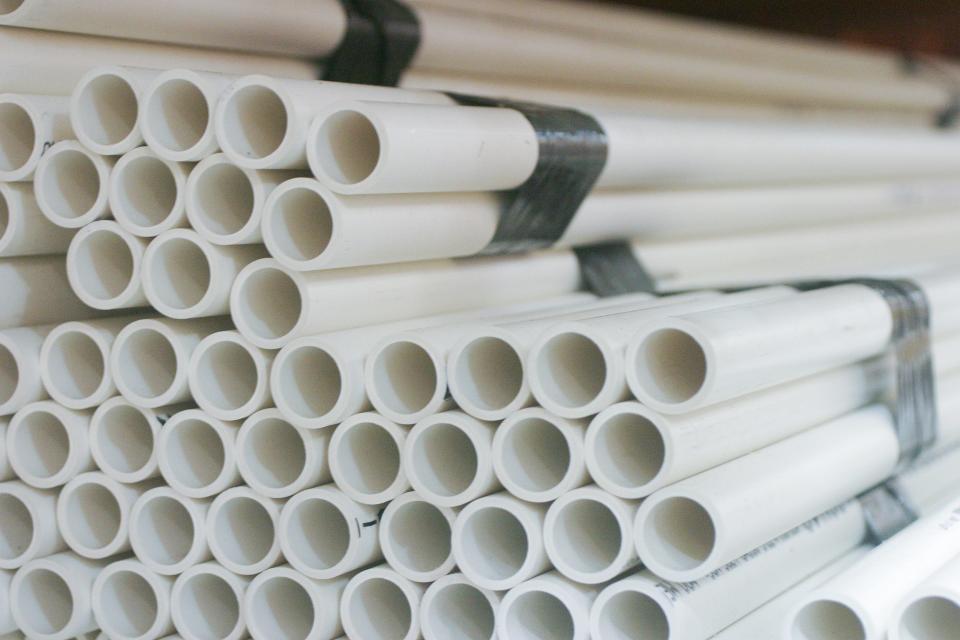 Stacks of PVC piping. While it is commonly used for drinking water, a new report claimed it can pose dangers. The industry says science doesn't support those conclusions.