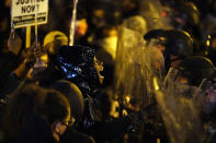 Protesters confront police during a march, Tuesday Oct. 27, 2020, in Philadelphia. Hundreds of demonstrators marched in West Philadelphia over the death of Walter Wallace, a Black man who was killed by police in Philadelphia on Monday. Police shot and killed the 27-year-old on a Philadelphia street after yelling at him to drop his knife. (AP Photo/Matt Slocum)