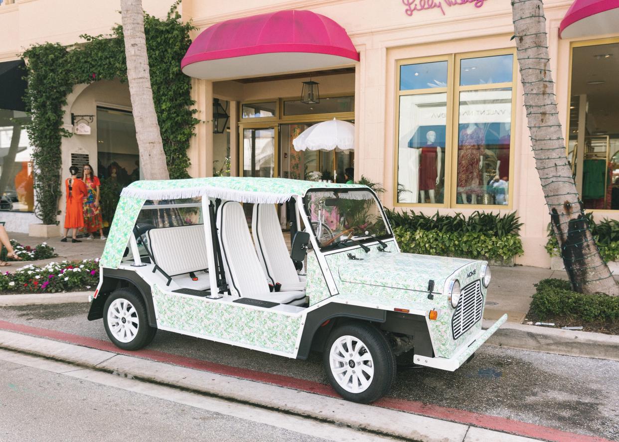 Lilly Pulitzer and Moke America partnered to create a Lilly-branded electric vehicle to celebrate the Palm Beach resort fashion brand's 65th anniversary. The vehicle is seen here in front of the Lilly Pulitzer store on Worth Avenue in Palm Beach.
