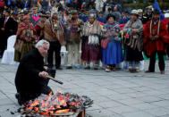 Bolivia's Vice President Alvaro Garcia Linera participates in an offering at a vigil during a satelite transmission of Bolivia and Chile presenting their arguments at the World Court, in La Paz, Bolivia, March 19, 2018. REUTERS/David Mercado