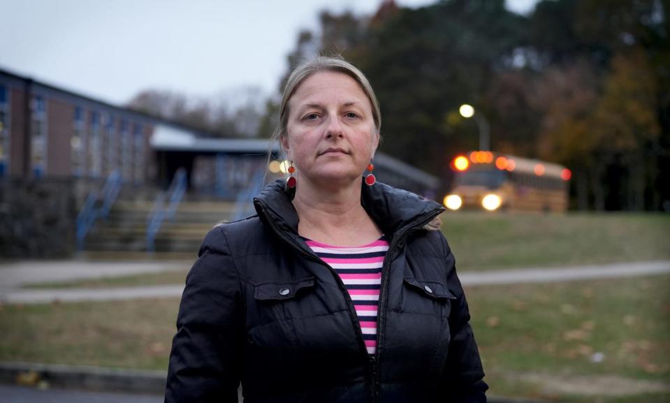 Megan Reilly stands in front of Davisville Middle School. Reilly organized opposition to the $222.5-million North Kingstown "Megabond" that would have replaced two middle schools, including Davisville, with one larger school.
