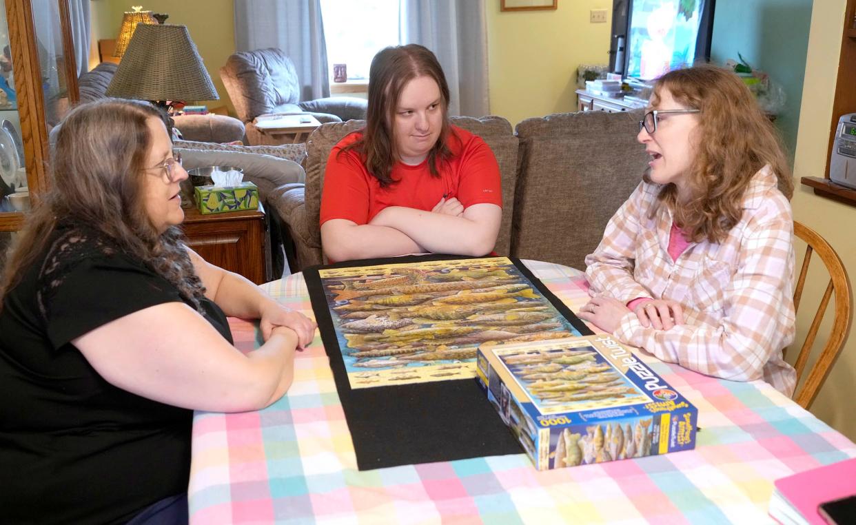 Milwaukee Journal Sentinel reporter Amy Schwabe (right) interviews Alison Peetz (left) and her son, Ben at their home in Brown Deer on April 18 for a Kids in Crisis story.