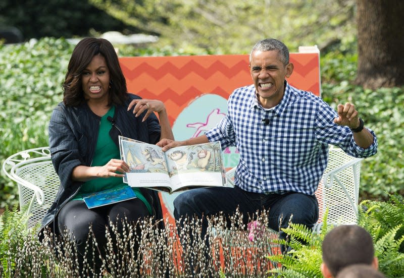US President Barack Obama and First Lady Michelle Obama read Maurice Sendak’s “Where the Wild Things Are” to children at the annual Easter Egg Roll at the White House in Washington, DC, on March 28, 2016.