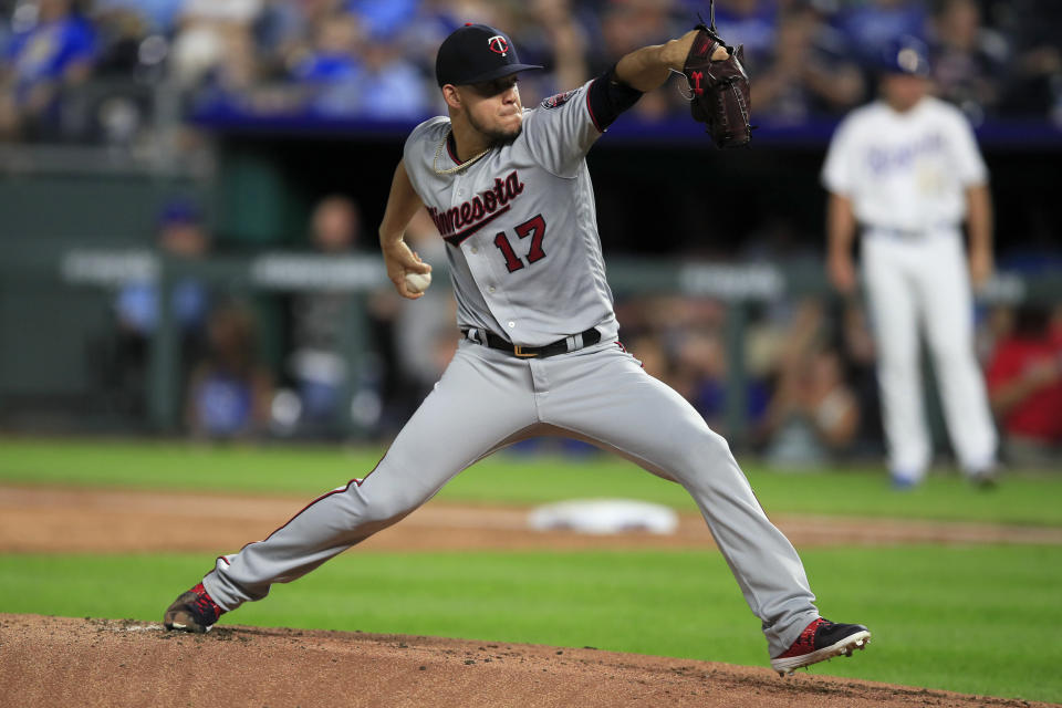 Minnesota Twins starting pitcher Jose Berrios delivers to a Kansas City Royals batter during the first inning of a baseball game at Kauffman Stadium in Kansas City, Mo., Friday, Sept. 27, 2019. (AP Photo/Orlin Wagner)