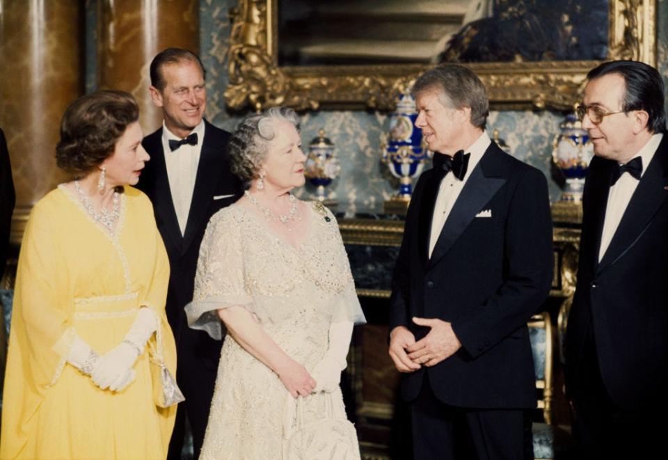 President Jimmy Carter speaks with the Queen and the Queen Mother as Prince Philip and Italian Prime Minister Giulio Andreotti look on.