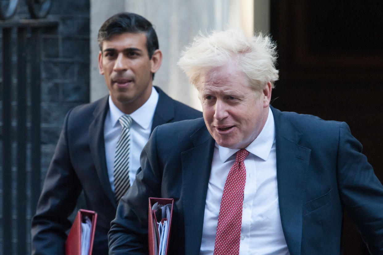 British Prime Minister Boris Johnson (R) and Chancellor of the Exchequer Rishi Sunak leave 10 Downing Street in central London to attend a Cabinet meeting as Parliament returns after summer recess amid the ongoing Coronavirus pandemic on 01 September, 2020 in London, England. (Photo by WIktor Szymanowicz/NurPhoto via Getty Images)