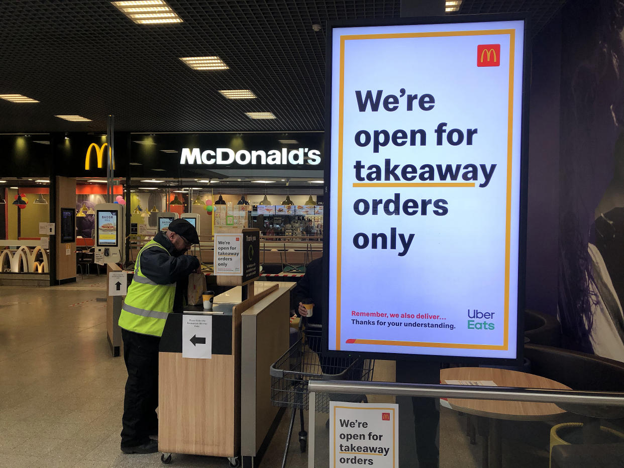 BRIGHTON - MARCH 20: A sign on a screen inside McDonalds telling customers they are open for takeaway orders only on March 20, 2020 in Brighton, England. Coronavirus (COVID-19) has spread to at least 182 countries, claiming over 10,000 lives and infecting almost 250,000. There have now been 3,269 diagnosed cases in the UK and 144 deaths. (Photo by Mike Hewitt/Mike Hewitt/Getty Images)