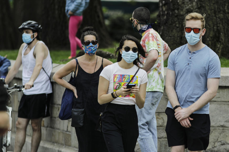 People wait in line for the Union Square Greenmarket to shop during the coronavirus pandemic Saturday, May 2, 2020, in New York. (AP Photo/Frank Franklin II)