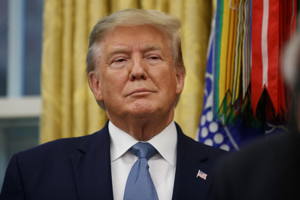 President Donald Trump stands during a ceremony to present the Presidential Medal of Freedom to former Attorney General Edwin Meese, in the Oval Office of the White House, Tuesday, Oct. 8, 2019, in Washington. (AP Photo/Alex Brandon)