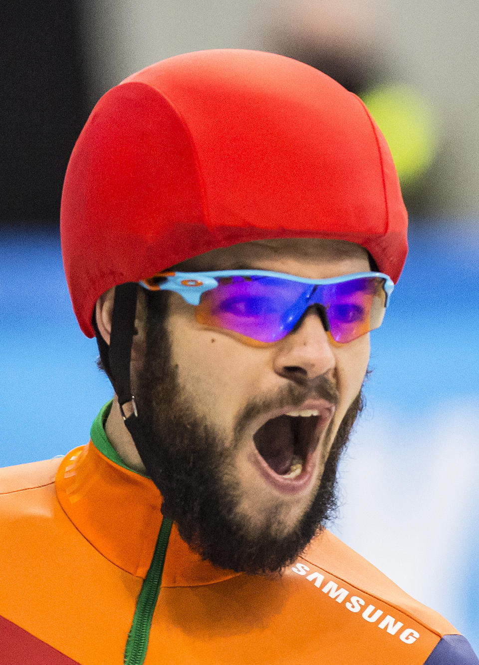 In this Saturday Jan. 2018 file image winner Sjinkie Knegt of Netherlands celebrates after crossing the finish line at the men's 500 meters final race at the short track speed skating European Championship in Dresden, eastern Germany. The Dutch ice skating association said Olympic short track speedskating silver medalist Knegt has suffered serious burns after his clothes caught fire Thursday morning Jan. 10, 2019, as he was lighting a wood-burning stove. (AP Photo/Jens Meyer)