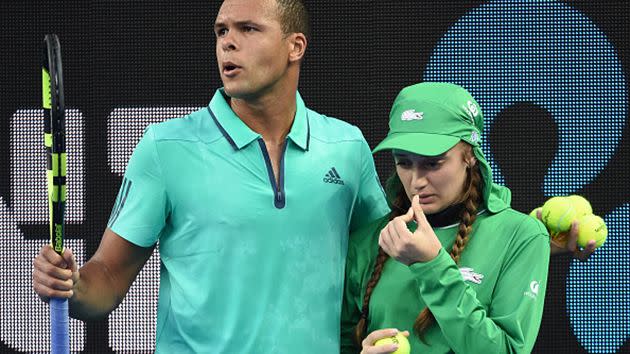 Tsonga helps the youngster. Image: Getty
