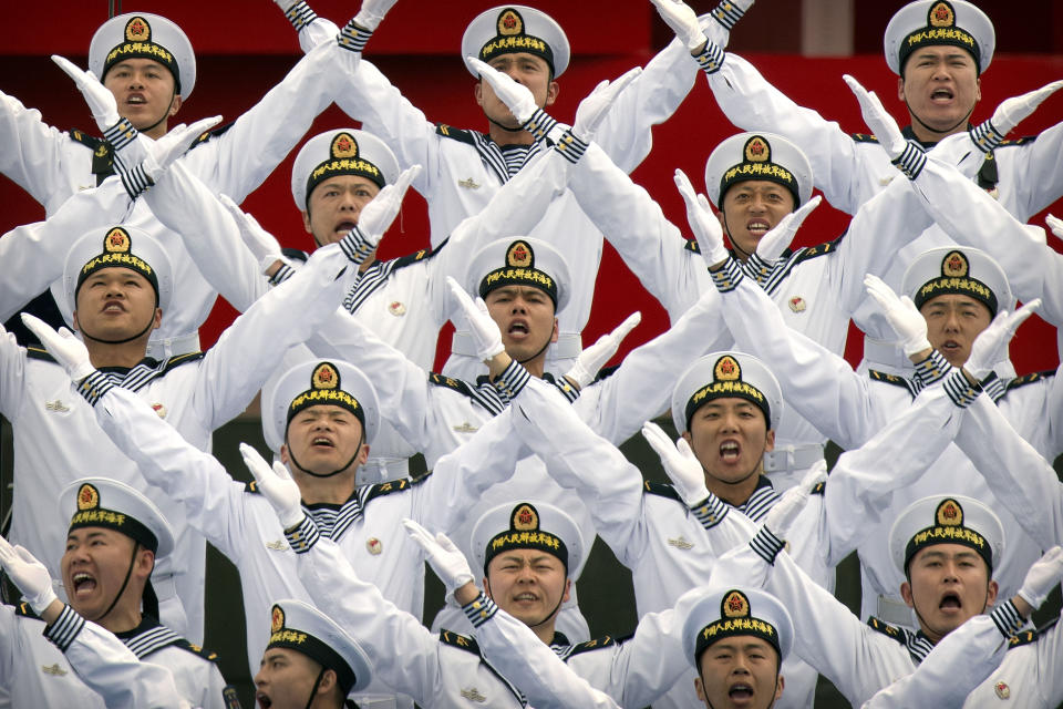 In this April 22, 2019, file photo, Chinese navy chorus performs during a concert featuring Chinese and foreign military bands in Qingdao. (AP Photo/Mark Schiefelbein, File)