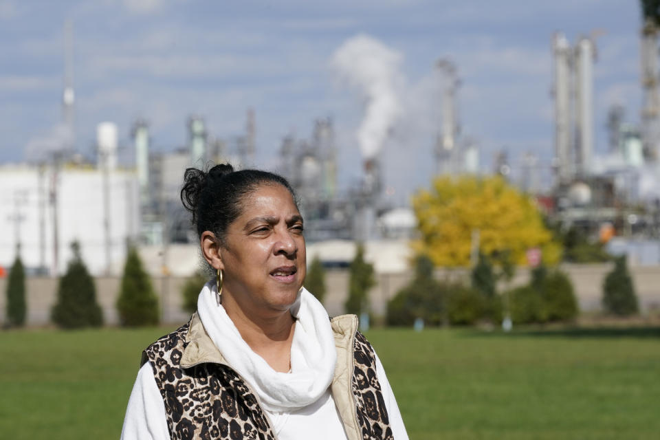 Theresa Landrum is photographed near the Marathon refinery, Friday, Oct. 16, 2020, in Detroit. Landrum wasn't impressed when told that Environmental Protection Agency chief Andrew Wheeler had pledged $200,000 to promote "community health initiatives" in her section of the city during his blitz of visits to battleground states in the presidential election campaign. (AP Photo/Carlos Osorio)