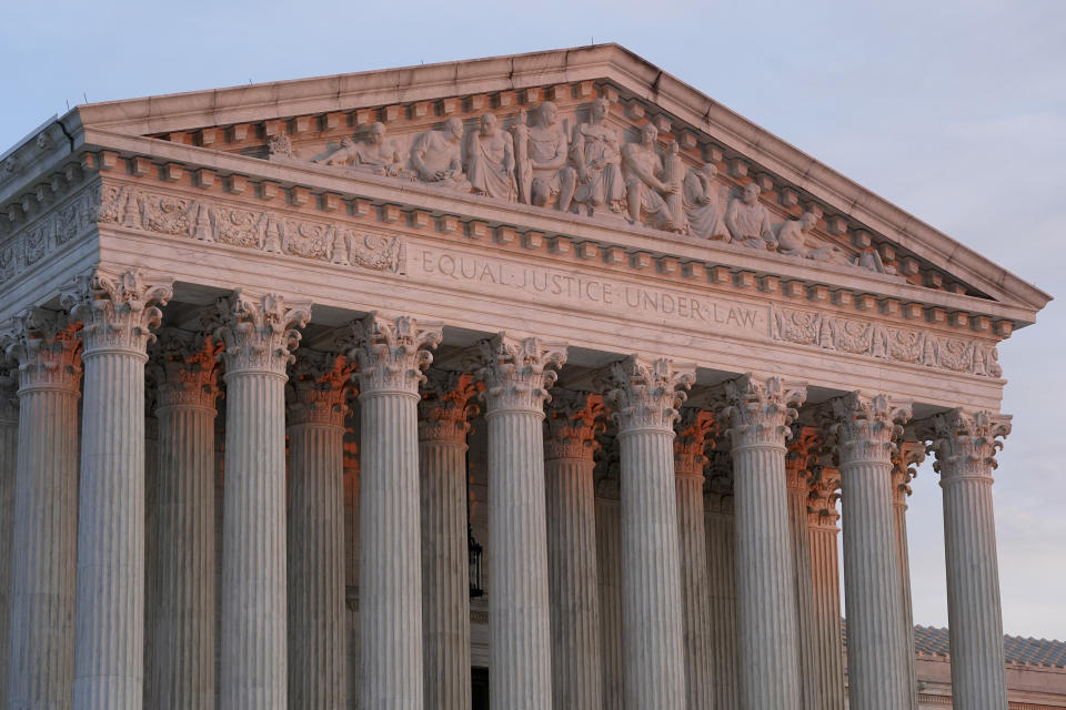 FILE - The setting sun illuminates the Supreme Court building on Capitol Hill in Washington, Jan. 10, 2023. The Supreme Court on Friday, Jan. 13, agreed to consider what employers must do to accommodate religious employees, among eight new cases it added. (AP Photo/Patrick Semansky, File)