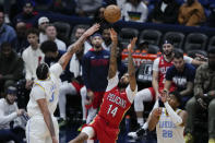 New Orleans Pelicans forward Brandon Ingram (14)m shoots between Los Angeles Lakers forward Anthony Davis (3) and forward Rui Hachimura (28) in the second half of an NBA basketball game in New Orleans, Saturday, Feb. 4, 2023. The Pelicans won 121-136. (AP Photo/Gerald Herbert)