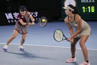 Japan's Shuko Aoyama, left, and Ena Shibahara return a shot to Czech Republic's Barbora Krejcikova and Katerina Siniakova in the women's doubles final at the Australian Open tennis championship in Melbourne, Australia, Sunday, Jan. 29, 2023. (AP Photo/Dita Alangkara)