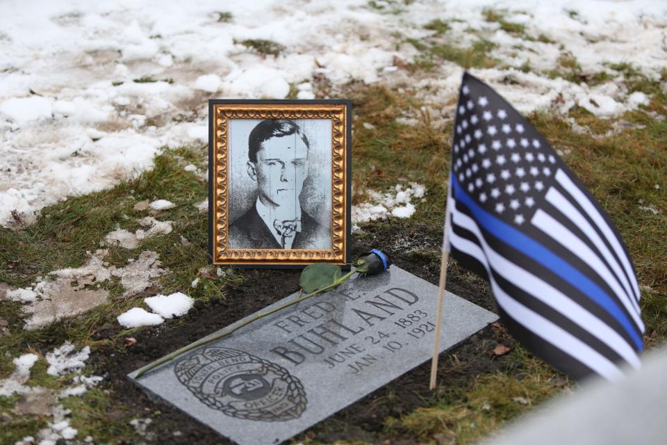 A dedication service Jan. 10, 2024, unveiled a new grave marker for South Bend Police Officer Fred E. Buhland, who died in the line of duty 103 years ago — on Jan. 10, 1921 — and had been buried in an unmarked grave in Highland Cemetery.