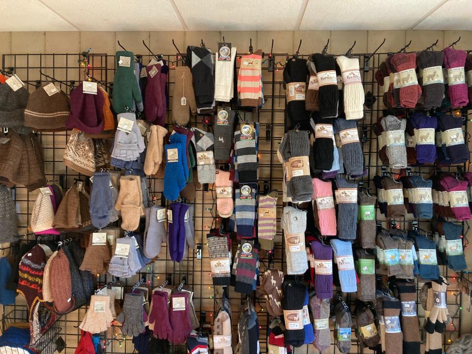 Garments that are locally made out of alpaca fiber are sold at Plain View Farm in Hubbardston.