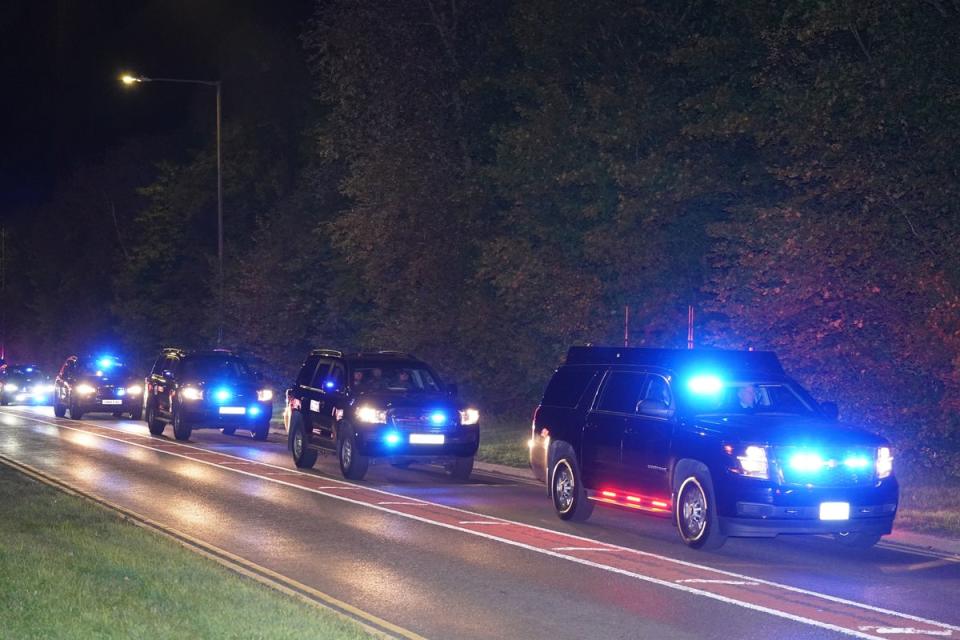 The Bidens are flanked by a convoy of cars on their way to London (PA)